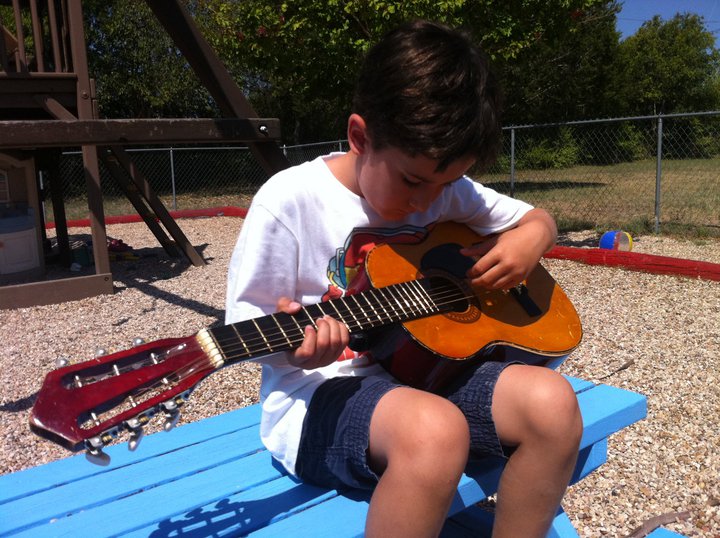 boy playing guitar